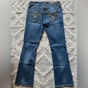 Rock Revival Bootcut Jeans with beautiful leather design back pockets.